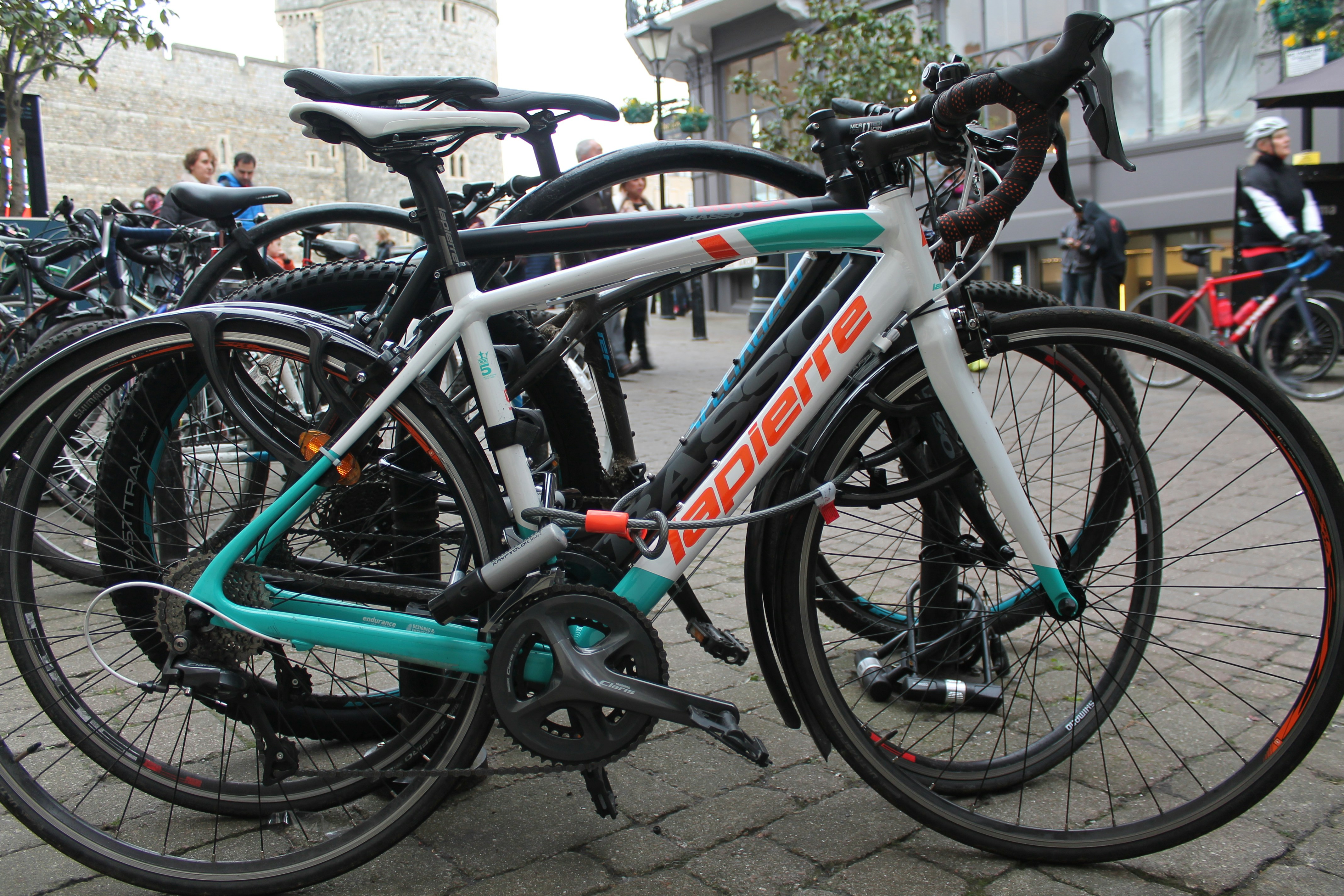 A lot of bikes in the street.